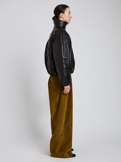 Proenza Schouler Side full length image of model wearing Laney Jacket In Semigloss Leather in Black