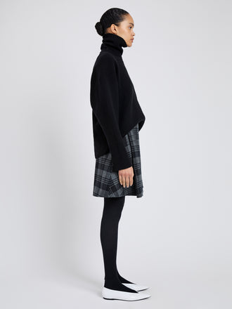 Proenza Schouler Side full length image of model wearing Cassia Skirt In Plaid Wool Suiting in Grey Multi