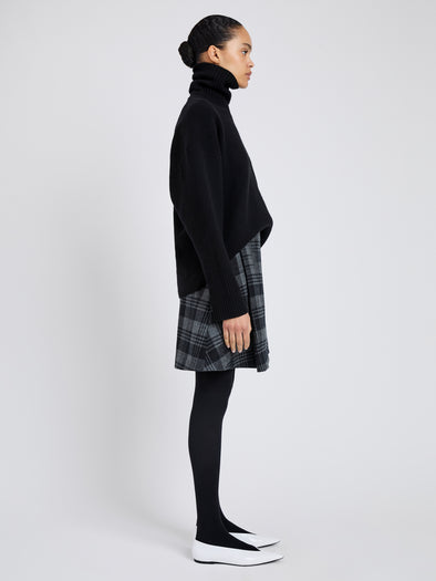 Proenza Schouler Side full length image of model wearing Cassia Skirt In Plaid Wool Suiting in Grey Multi