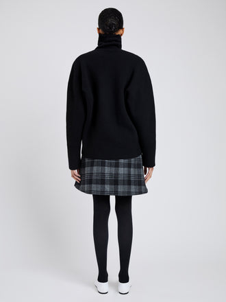 Proenza Schouler Back full length image of model wearing Cassia Skirt In Plaid Wool Suiting in Grey Multi