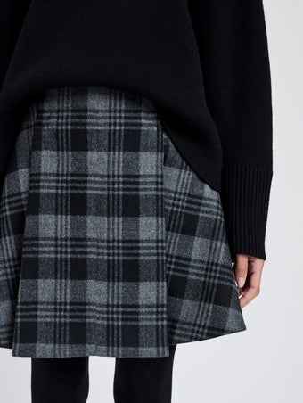 Proenza Schouler Detail image of model wearing Cassia Skirt In Plaid Wool Suiting in Grey Multi