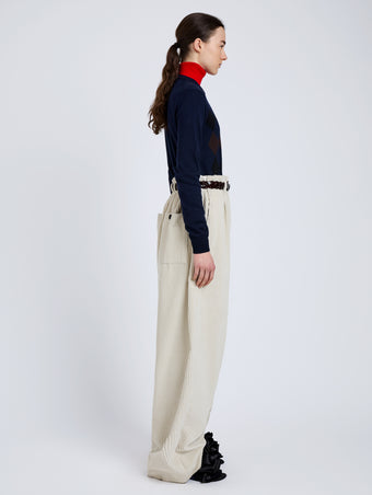 Proenza Schouler Side full length image of model wearing Vivian Top In Argyle Knit in Navy Multi