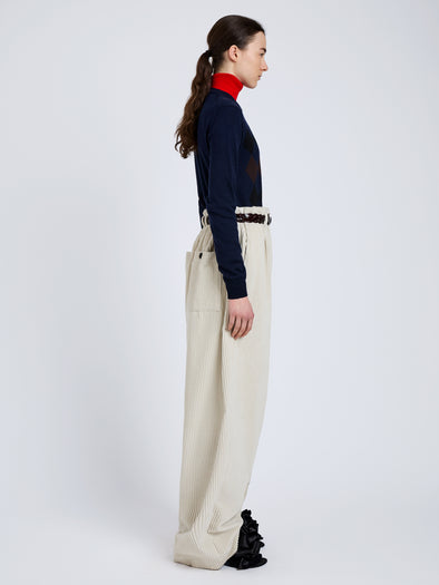 Proenza Schouler Side full length image of model wearing Vivian Top In Argyle Knit in Navy Multi