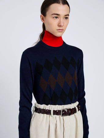 Proenza Schouler Detail image of model wearing Vivian Top In Argyle Knit in Navy Multi