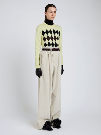 Proenza Schouler Side full length image of model wearing Vivian Top In Argyle Knit in Yellow Multi