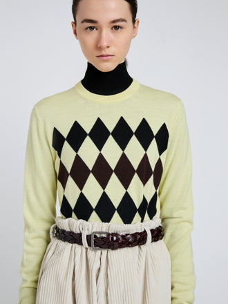 Proenza Schouler Detail image of model wearing Vivian Top In Argyle Knit in Yellow Multi
