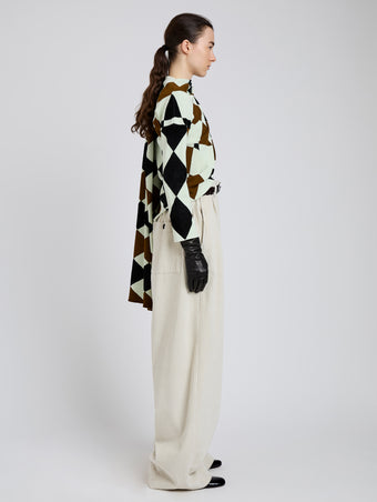 Proenza Schouler Side full length image of model wearing Vanne Top in Argyle Velvet Knit in Light Green Multi