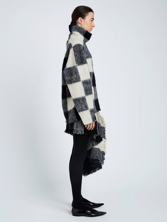 Proenza Schouler Side full length image of model wearing Kai Skirt In Brushed Glenplaid Knit in Black Multi