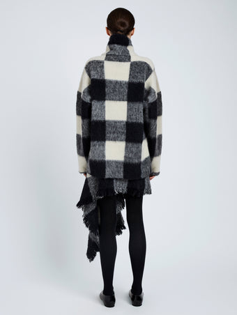 Proenza Schouler Back full length image of model wearing Kai Skirt In Brushed Glenplaid Knit in Black Multi