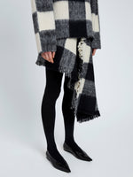 Proenza Schouler Detail image of model wearing Kai Skirt In Brushed Glenplaid Knit in Black Multi