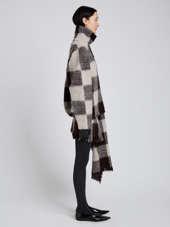 Proenza Schouler Side full length image of model wearing Kai Skirt in Brushed Glenplaid Knit in Brown Multi