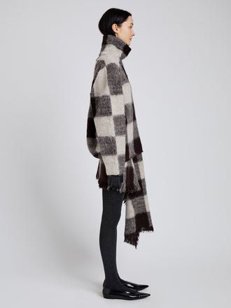 Proenza Schouler Side full length image of model wearing Kai Skirt in Brushed Glenplaid Knit in Brown Multi