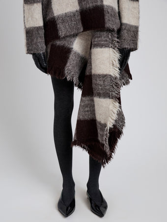 Proenza Schouler Detail image of model wearing Kai Skirt in Brushed Glenplaid Knit in Brown Multi
