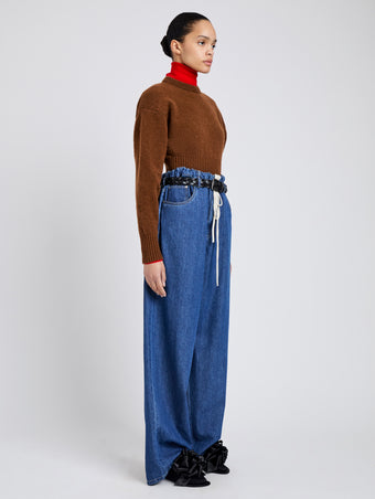 Proenza Schouler Side full length image of model wearing Salome Jean in Lightweight Denim in Medium Blue