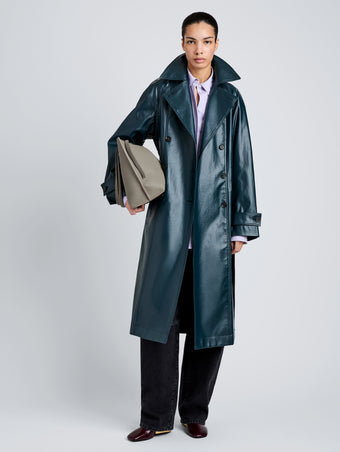 Proenza Schouler Front full length image of model wearing Benedetta Trench Coat in Coated Cotton in Bottle Green