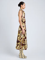 Proenza Schouler Side full length image of model wearing Adelide Dress in Printed Silk Viscose in Rust Multi