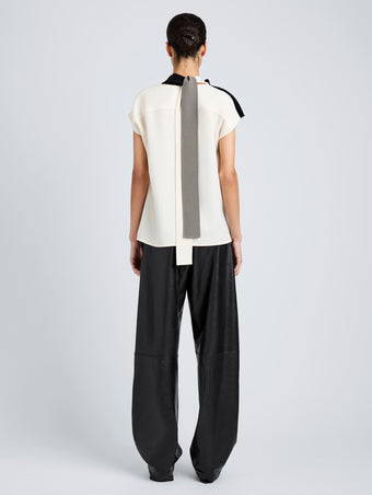 Proenza Schouler Back full length image of model wearing Elsa Top in Matte Double Crepe in Black Multi
