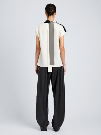 Proenza Schouler Back full length image of model wearing Elsa Top in Matte Double Crepe in Black Multi