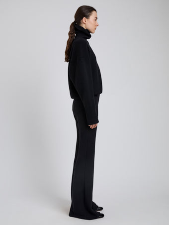 Proenza Schouler Side full length image of model wearing Kalea Pant in Compact Stretch Crepe in Black