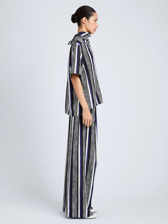 Proenza Schouler Side full length image of model wearing Amira Pant in Printed Silk Habotai in Black Multi