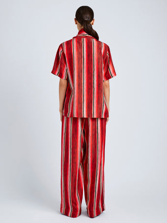 Proenza Schouler Back full length image of model wearing Amira Pant in Printed Silk Habotai in Vermillion Multi