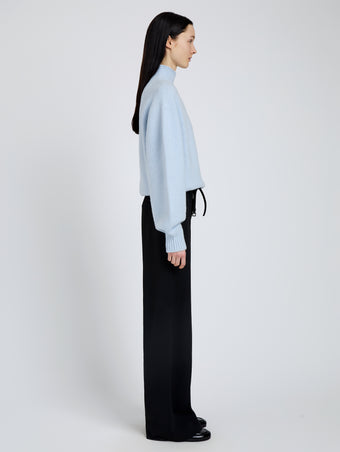 Proenza Schouler Side full length image of model wearing Adley Top in Solid Cashmere Blend in Light Blue