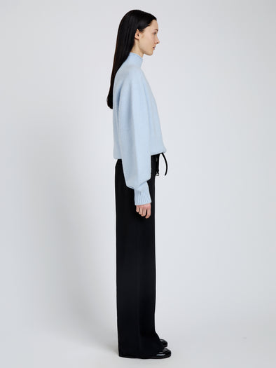 Proenza Schouler Side full length image of model wearing Adley Top in Solid Cashmere Blend in Light Blue