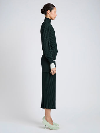 Proenza Schouler Side full length image of model wearing Luiza Skirt in Sunburst Rib in Bottle Green