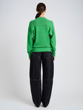 Proenza Schouler Back full length image of model wearing Niccola Top in Cotton Tape Knit in Green
