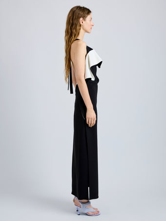 Proenza Schouler Side full length image of model wearing Sanna Dress in Matte Double Crepe in BlackIvory