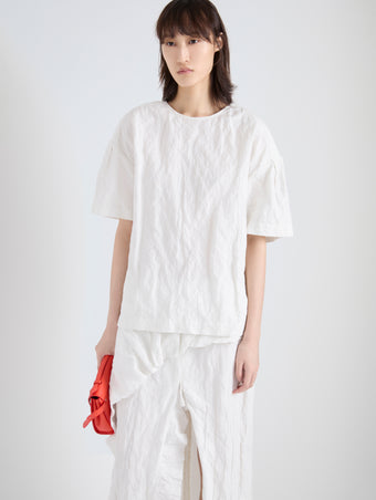 Proenza Schouler Detail image of model wearing Hansly Top in Memory Cotton in Off White