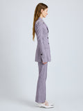 Proenza Schouler Side full length image of model wearing Lorenza Pant in Static Suiting in AubergineWhite