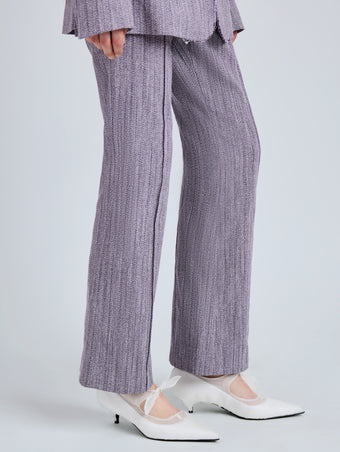 Proenza Schouler Detail image of model wearing Lorenza Pant in Static Suiting in AubergineWhite