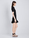 Proenza Schouler Side full length image of model wearing Leandra Dress in Viscose Ribbed Godet in Black