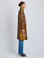 Proenza Schouler Side full length image of model wearing Leticia Coat in Python Print in Gold Multi