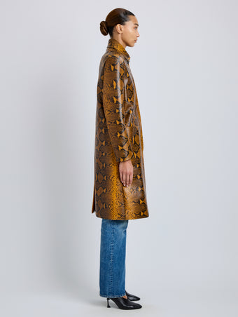 Proenza Schouler Side full length image of model wearing Leticia Coat in Python Print in Gold Multi