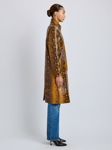 Proenza Schouler Side full length image of model wearing Leticia Coat in Python Print in Gold Multi