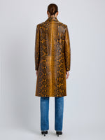 Proenza Schouler Back full length image of model wearing Leticia Coat in Python Print in Gold Multi