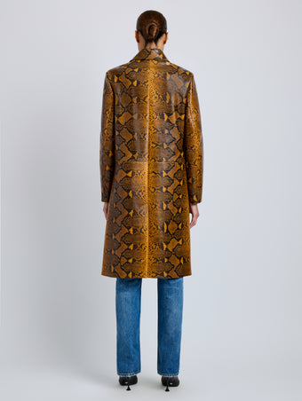 Proenza Schouler Back full length image of model wearing Leticia Coat in Python Print in Gold Multi