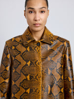 Proenza Schouler Detail image of model wearing Leticia Coat in Python Print in Gold Multi