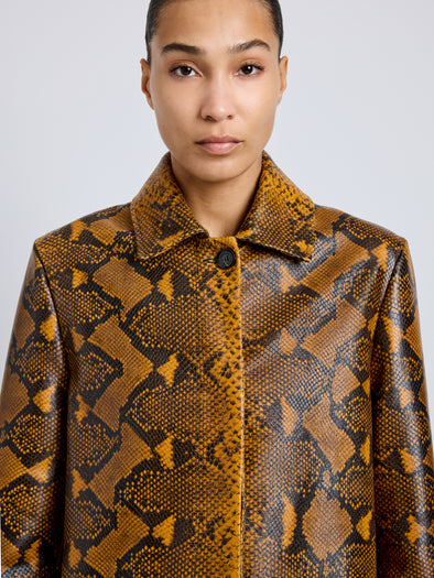 Proenza Schouler Detail image of model wearing Leticia Coat in Python Print in Gold Multi