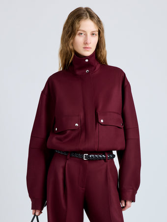 Proenza Schouler Front cropped image of model wearing Aviva Jacket in Wool Gabardine in Oxblood