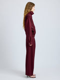 Proenza Schouler Side full length image of model wearing Aviva Jacket in Wool Gabardine in Oxblood
