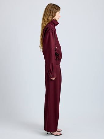 Proenza Schouler Side full length image of model wearing Aviva Jacket in Wool Gabardine in Oxblood