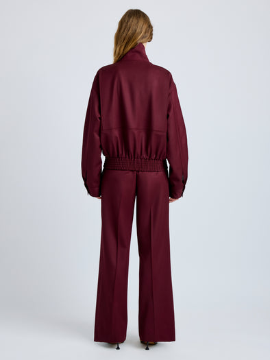 Proenza Schouler Back full length image of model wearing Aviva Jacket in Wool Gabardine in Oxblood