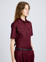 Proenza Schouler Detail image of model wearing Nali Top in Wool Gabardine in Oxblood