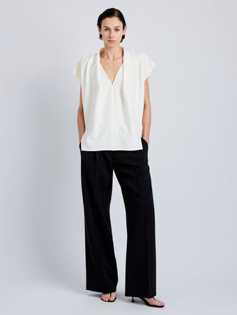 Proenza Schouler Front full length image of model wearing Ranli Top in Matte Double Crepe in Alabaster