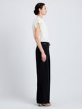 Proenza Schouler Side full length image of model wearing Ranli Top in Matte Double Crepe in Alabaster