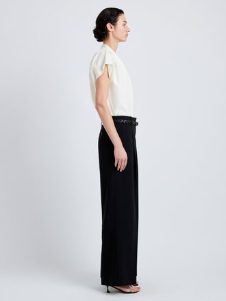 Proenza Schouler Side full length image of model wearing Ranli Top in Matte Double Crepe in Alabaster