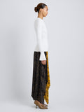 Proenza Schouler Side full length image of model wearing Paulina Dress in Pleated Georgette in Gold Multi